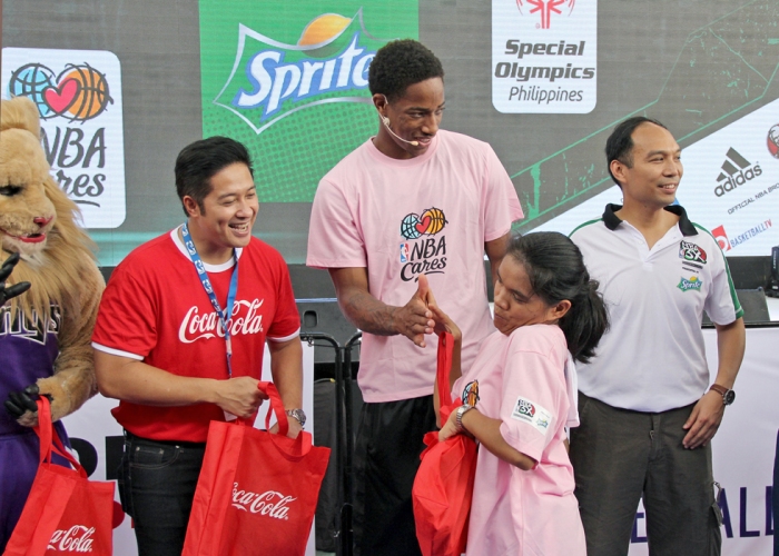 (L-R) Atty. Adel Tamano, Vice President for Public Affairs and Communications of Coca-Cola Philippines, DeMar DeRozan, NBA All-Star guard for the Toronto Raptors  and Carlo Singson, P H Country Manager, NBA Asia, Limited  gave out lootbags to the Philippine Special Olympics athletes after the NBA Cares Presented by Sprite basketball clinic. Together, NBA and Sprite share a commitment to encouraging physical activity and healthy living through sports.